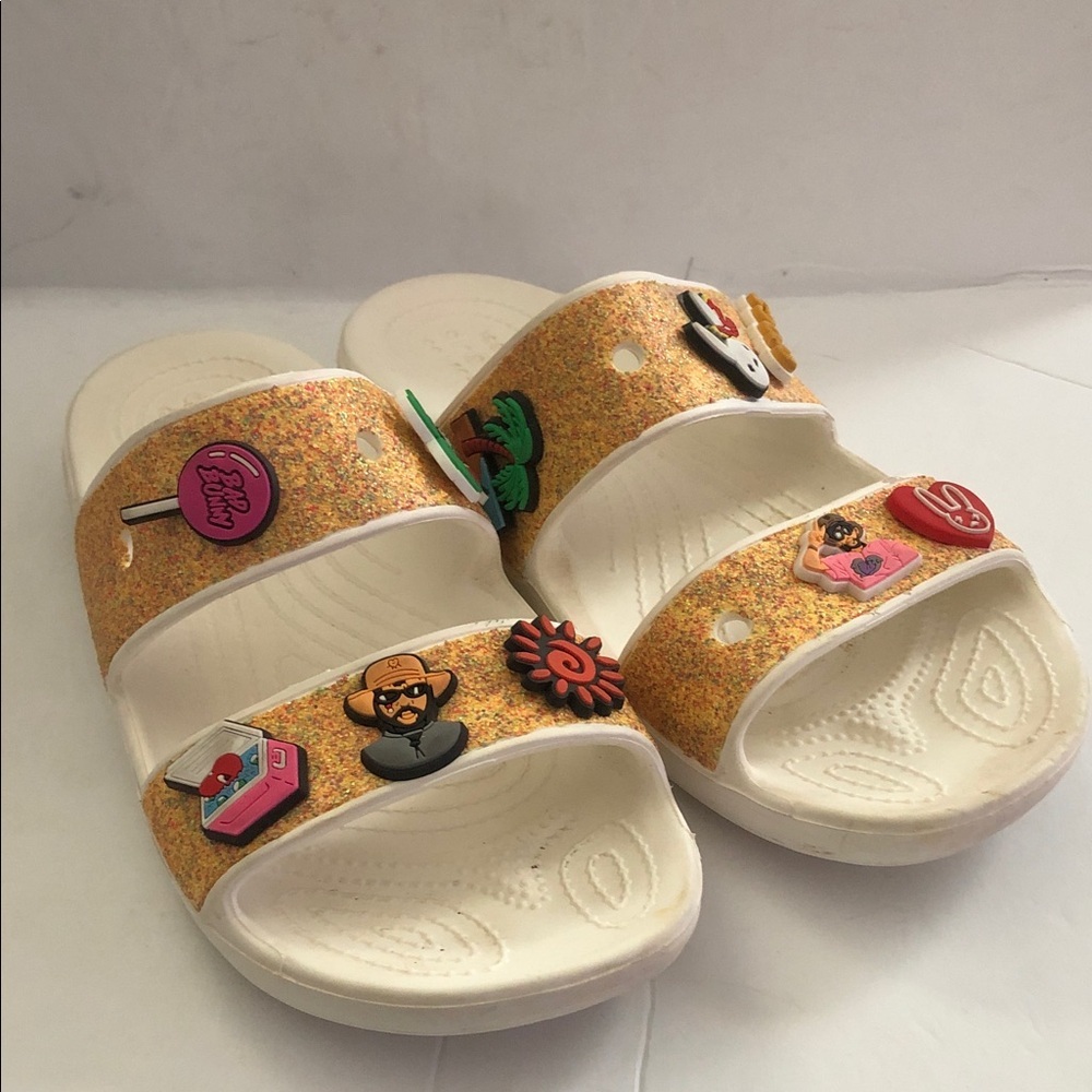 Crocs Classic Orange Sorbet Glitter Sandals with 10 Jibbitz charms.